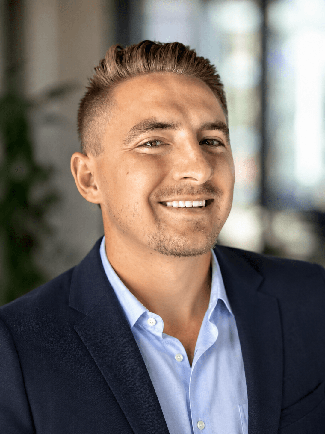 Professional headshot of Ethan Huffaker